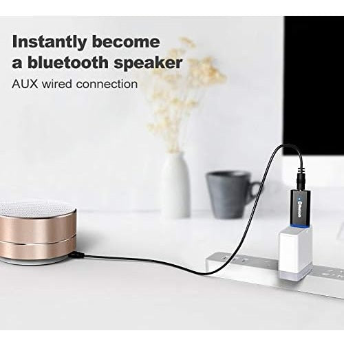 Adaptador receptor Bluetooth USB para computadoras de la marca 0004, conectado a un puerto USB en una computadora.